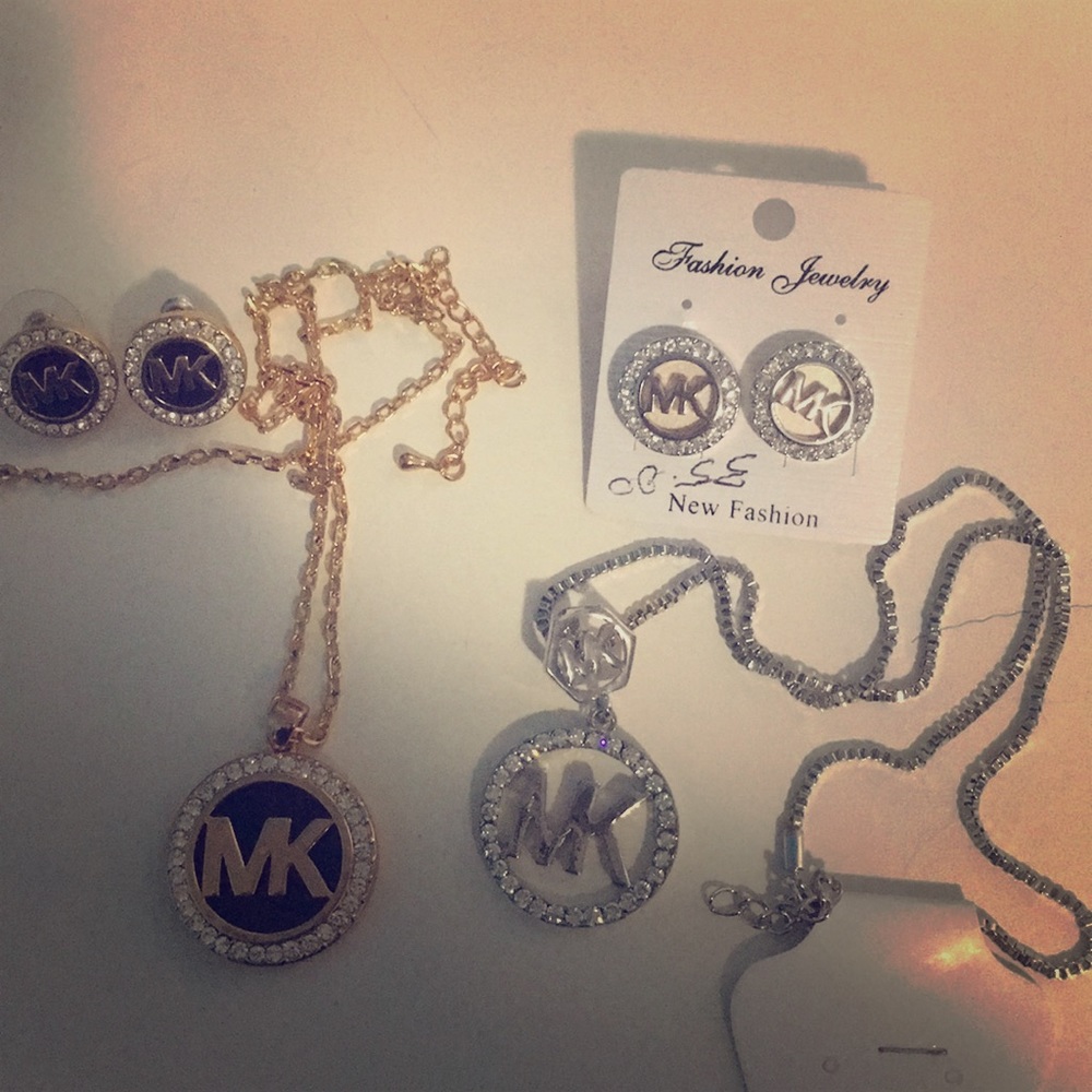 Michael Kors earnings nad necklace